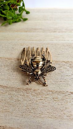 Gold Bee Comb Hair Clip - Size: 1-1/4" x 2"- 6 Teeth Clip- Material: Zinc Alloy- Color/Finish: Gold Perfect accessory for a Bee Lover! Comb Hair Clip, Hair Clips Gold, Black Rose Ring, Hair Tie Holder, Teeth Clip, Snake Gift, Bee Lover Gifts, Hair Comb Clips, Gold Hair Comb