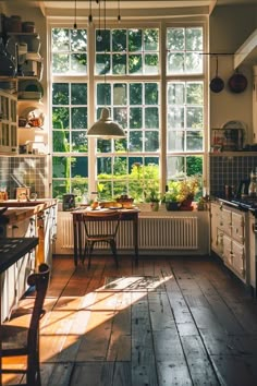 the kitchen is clean and ready to be used for cooking or baking, with sun shining through the windows