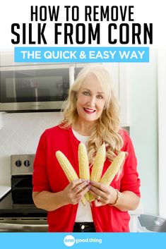 a woman holding two ears of corn in her hands with the title how to remove silk from corn