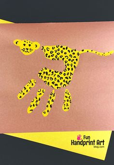 a paper cut out of a cheetah with yellow and black dots on it