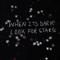 the words when it's dark look for stars are written in white on a purple background