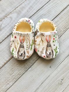 "Rabbit print handmade soft sole baby shoes / crib shoes. They are comfortable and easy to put on and off. The bottom of the sole is made with anti slip fabric so safe for your little one. They are available in different sizes: Size 1 ( 0-3m ) recommend foot measurement 3.75\" or less Size 2 ( 3-6m ) recommend foot measurement 4\" or less Size 3 ( 6-9m ) recommend foot measurement 4.25\" or less Size 4 ( 9-12m ) recommend foot measurement 4.5\" or less Size 5 ( 12-18m ) recommend foot measuremen First Easter Basket Ideas, Newborn Shoes Pattern, Soft Sole Baby Shoes Pattern, First Easter Basket, Baby Bunny Shoes, Crib Shoe, Crochet Baby Shoes Chubby Feet, Indoor Shoes, Soft Sole Baby Shoes