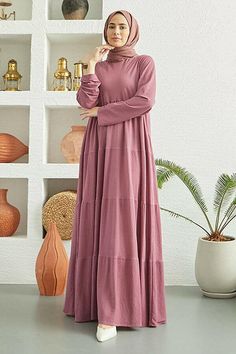 This pleated maxi dress combines modest elegance with versatility. Crafted from lightweight, breathable mixed fabric, it features tiered pleats that drape gracefully, making it a suitable choice for any season and an ideal option for warm spring days. The dress is beautifully crafted so that it looks great on all body types. Length and Fabric Content: Available Size: 38 - 40 - 42 - 44-46 Dimensions of the Product Model: Size: 38 cm Height: 144 cm Bust: 112cm Waist: 148cm Hips: 152 cm Special Notes: There is an average of "4 cm" difference between sizes. Washing Instructions: Machine wash cold, with like colors. Lay flat to dry. Warm iron as needed. Casual Pink Pleated Maxi Dress, Modest Pleated Maxi Dress, Flowy Tiered Pleated Midi Dress, Modest Flowy Pleated Maxi Dress, Casual Pleated Tiered Midi Dress, Flowy Pink Pleated Maxi Dress, Flowy Pleated Pink Maxi Dress, Spring Tiered Maxi Dress, Pink Pleated Maxi Dress