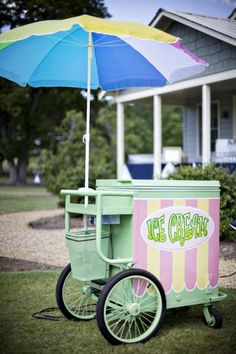 an ice cream cart sitting in the grass