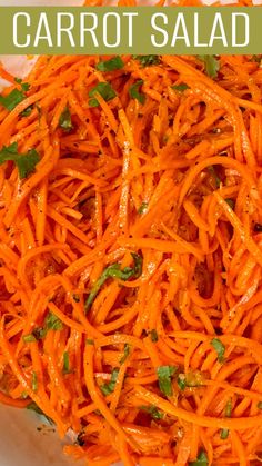 carrot salad in a white bowl with the title above it that reads, carrot salad