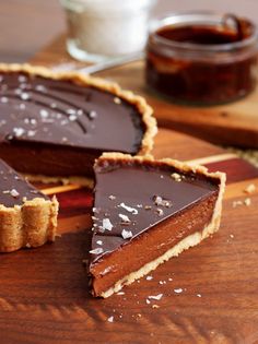 there is a piece of chocolate pie on the cutting board