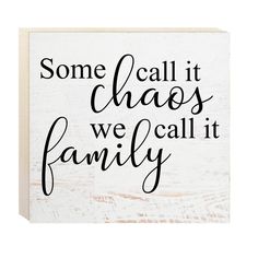 a wooden sign that says, some call it chaos we call it family on it