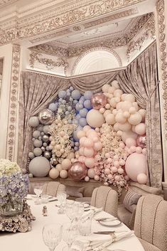 a large balloon wall in the middle of a dining room