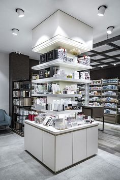 the inside of a cosmetics store with lots of shelves