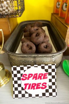 there are donuts that are in the pan on the table with some napkins