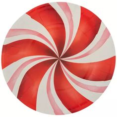 a red and white paper plate with a large candy cane design on the front side