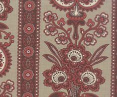 a red and white floral design on fabric