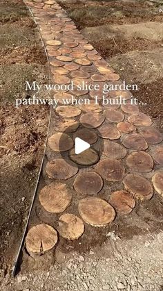 a path made out of logs with the words, my wood slice garden pathway when i built it