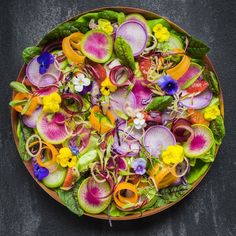 a plate filled with lots of colorful vegetables