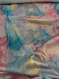 the fabric is very colorful and it looks like it has been dyed with glitters