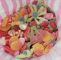 a bowl filled with lots of different colored candies