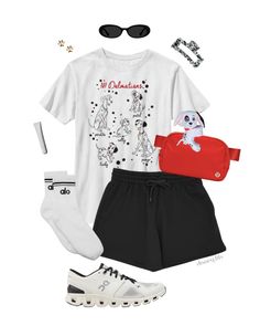 a white shirt, black shorts and sneakers