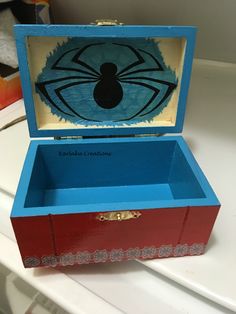 an open wooden box sitting on top of a table next to a white countertop