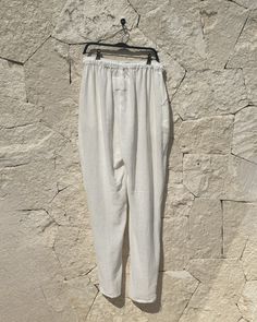 Color: White Size Large-XL Lenght 110 cm / Width 54 cm / Cross: 37 cm Fit: Oversized Fit 2 pockets 100% Cotton Handmade in Tulum, Mexico DeliveryOrders will usually ship whitin 2-3 business days from Tulum, Mexico 100% Delivery Guarantee. If a product you ordered arrived damaged/broken or was lost during delivery -we will resend you the same product again without any additional cost! White Bottoms With Straight Hem For Summer, White Linen Bottoms For Daywear, White Trousers With Side Pockets, White Ankle-length Pants With Pockets, White Cotton Tapered Leg Harem Pants, White Linen Pants With Straight Hem, White Relaxed Bottoms With Side Pockets, White Relaxed Fit Linen Bottoms, Daywear Bottoms With Pockets And Straight Hem