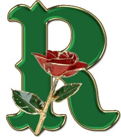 a red rose sitting on top of a green letter