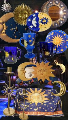 there are many sun and moon decorations on display in this shop window, including mugs