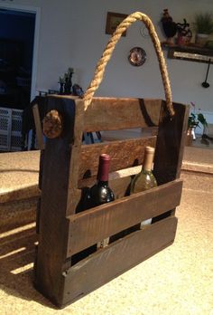 a wooden crate with wine bottles in it