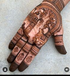 the hand is decorated with intricate designs