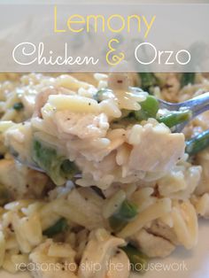 a white plate topped with pasta and chicken next to a green pepper covered spoon on top of it