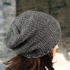 Stay warm and stylish this autumn with our Slouchy Beanie Hat. Made from a soft and cozy blend of acrylic and wool, this hat is perfect for the colder seasons. Available in a variety of colors, you can choose the perfect one to match your individual style. This hat is designed to fit head sizes 55-58 cm or 21.5-22.8 inches, and is available in sizes S-XL. Each hat is hand knit by myself, so you can be sure you are receiving a unique and high-quality item. Custom orders may take 3-5 days to be made and shipped. All orders are shipped via registered airmail, with delivery times varying depending on your location. The European Union typically takes 2-5 business days, while the United States and Canada take 5-14 business days. If you have any questions or special requests, please do not hesita Gray Hand Knitted Hat, One Size Fits Most, Gray Hat For Cold Weather, One Size, Gray Knitted Beanie Cap, Warm Gray One-size Beanie, Gray Hand-knitted Cap, Slouchy Beanie Hat, Hat For Men, Hat For Man, Slouchy Beanie