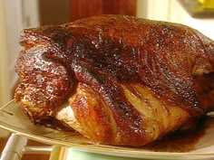 there is a large roasting turkey on a plate