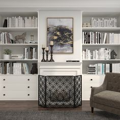 a living room with bookshelves and a fireplace in the center, surrounded by white bookcases