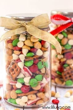 two glass jars filled with different types of candy