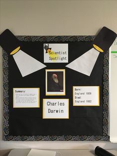 a bulletin board with pictures and writing on it