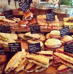 many different types of sandwiches are on display