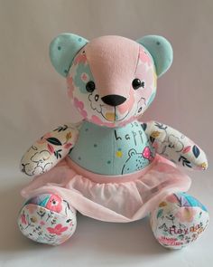 a teddy bear wearing a blue dress and pink shoes