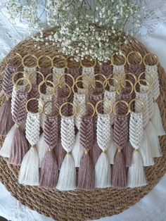 a bunch of tassels that are sitting on a wicker basket with flowers in the background