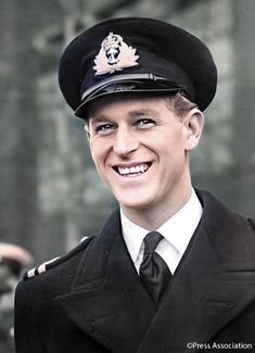 a man in uniform is smiling for the camera