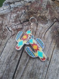 These cute cactus earrings feature a colorful western look. Casual Multicolor Dangle Jewelry, Casual Multicolor Nickel-free Jewelry, Cute Multicolor Jewelry With Ear Wire, Cute Multicolor Jewelry, Multicolor Southwestern Summer Jewelry, Casual Colorful Earrings As A Gift, Southwestern Style Earrings For Summer, Casual Multicolor Earrings For Festivals, Casual Multicolor Festival Earrings