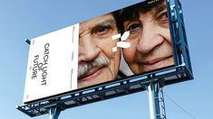 a billboard with an image of two older men on it