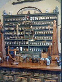 an old fashioned pharmacy cabinet filled with lots of bottles