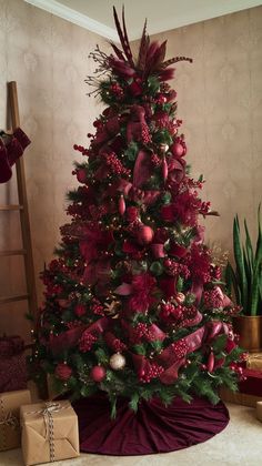 a decorated christmas tree with red ornaments