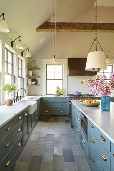 an image of a kitchen with blue cabinets