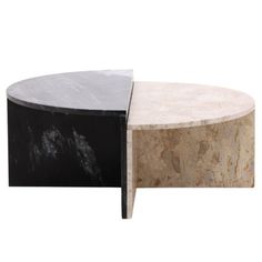 two round tables with marble tops on each side and one black one in the middle