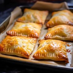 baked pastries on a baking sheet ready to be eaten