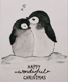 a couple of penguins hugging each other on top of a snow covered ground with the words happy