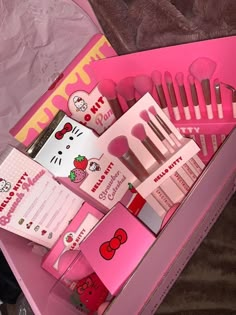 the hello kitty makeup set is in its pink box and it's contents are neatly packed