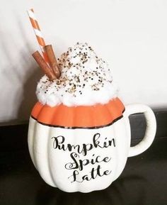 a pumpkin spice latte in a white mug