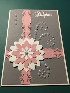 a close up of a card with flowers on it