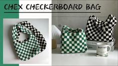 the checkerboard bag is sitting next to a coffee mug and other items that are on display