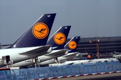 three airplanes are parked on the tarmac at an airport